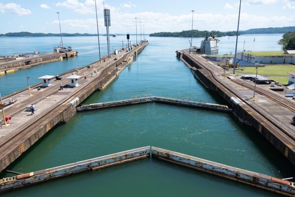 A dock with several piers and a body of water.