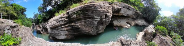 A rock formation with water in it