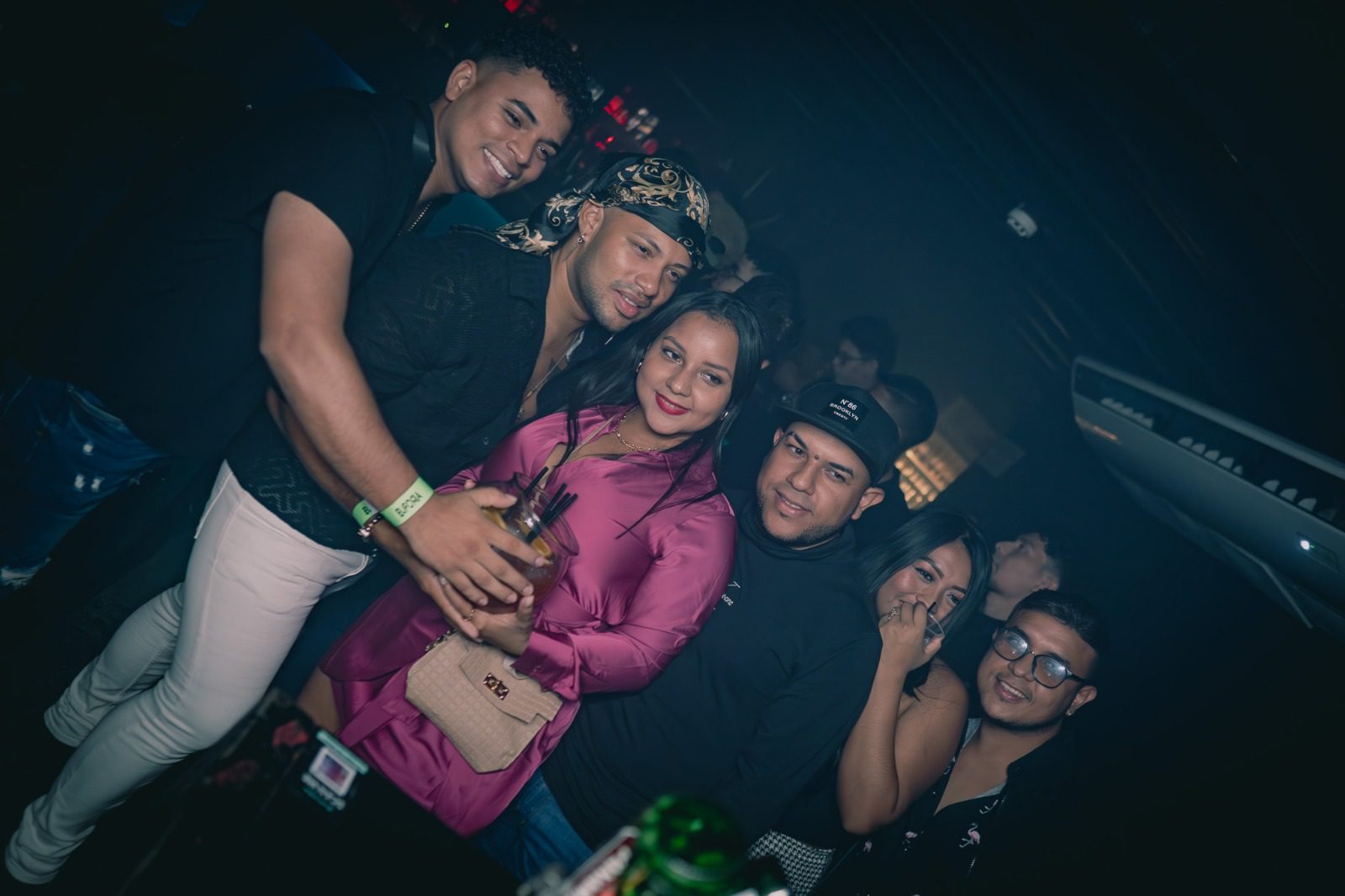 Group of friends enjoying a night out at a club.